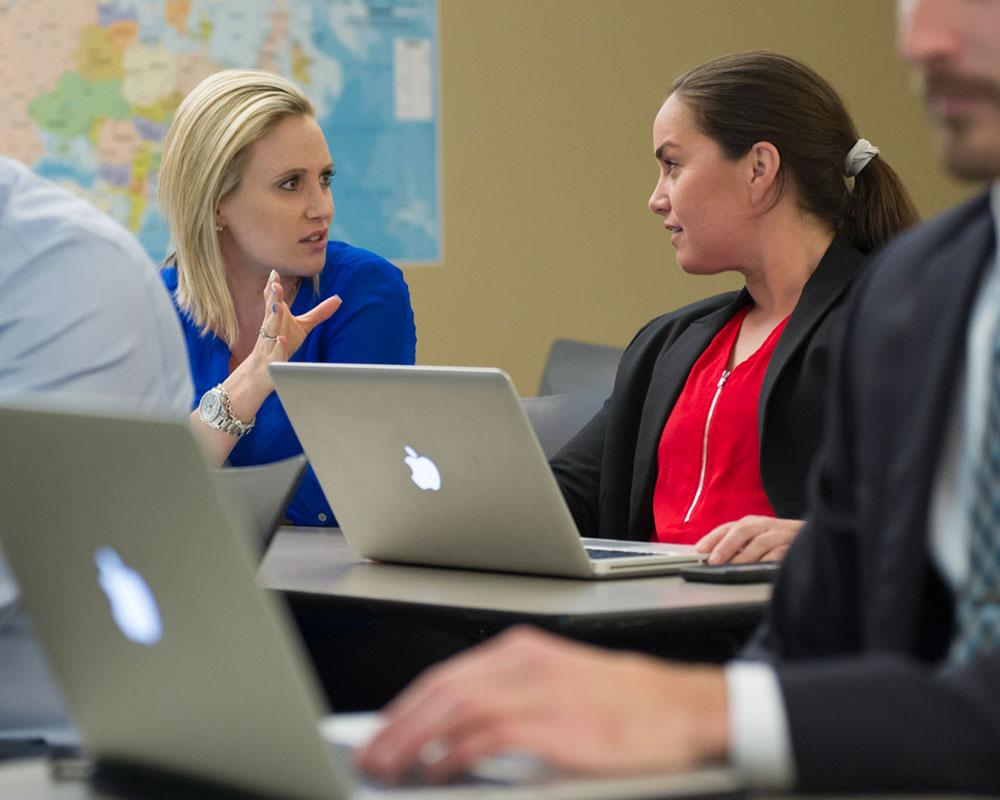 Women working together in class